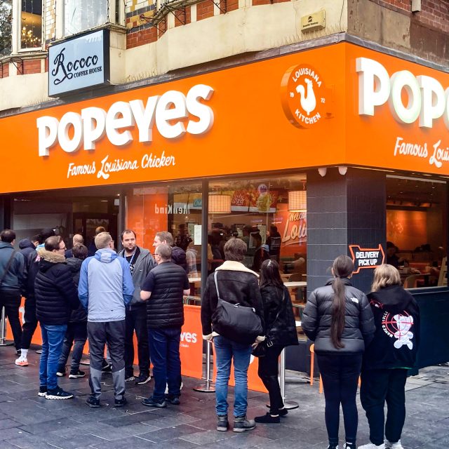 A queue outside popeyes chicken